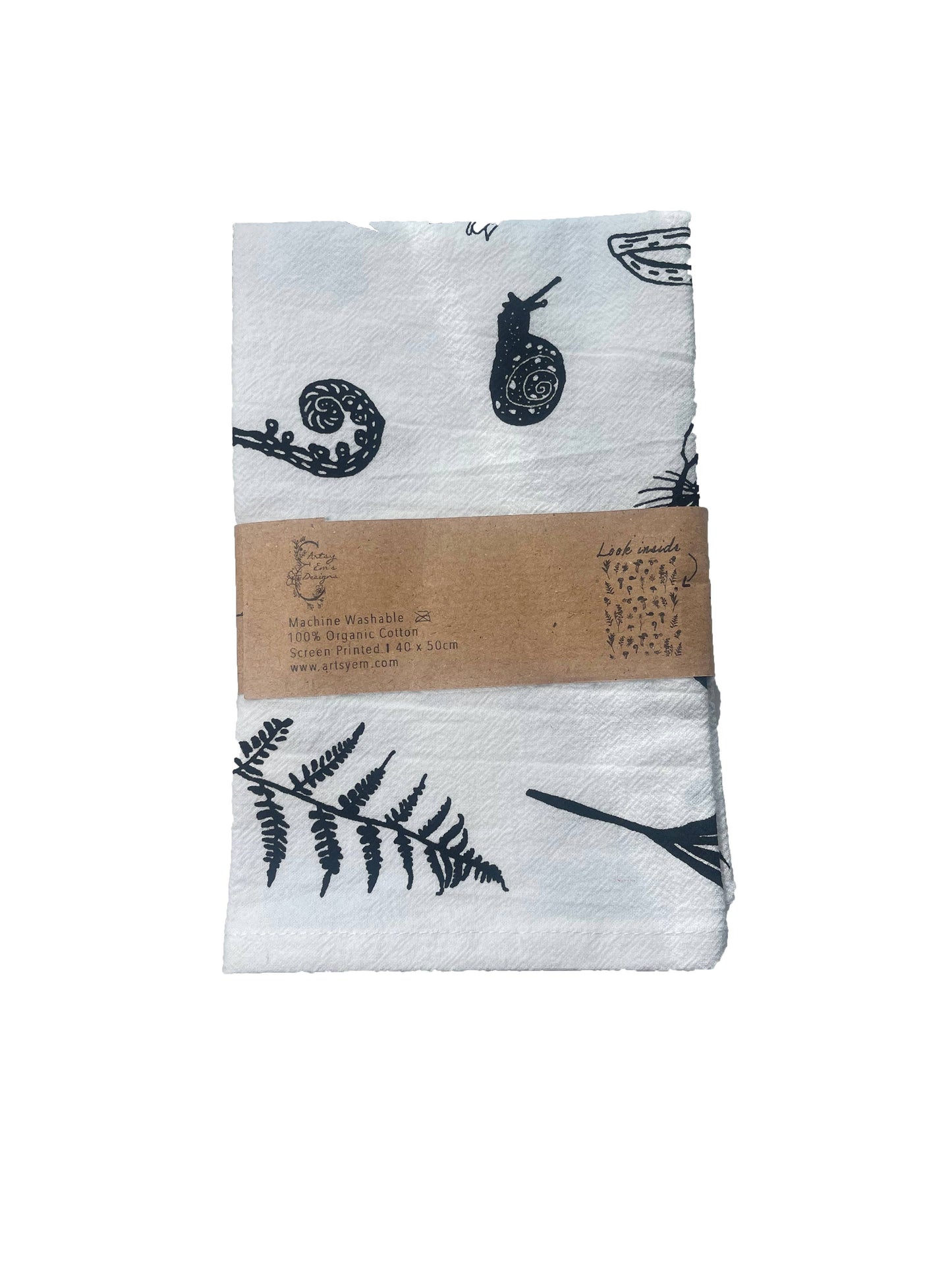 White fabric with black nature-themed patterns and a brown label on a white background