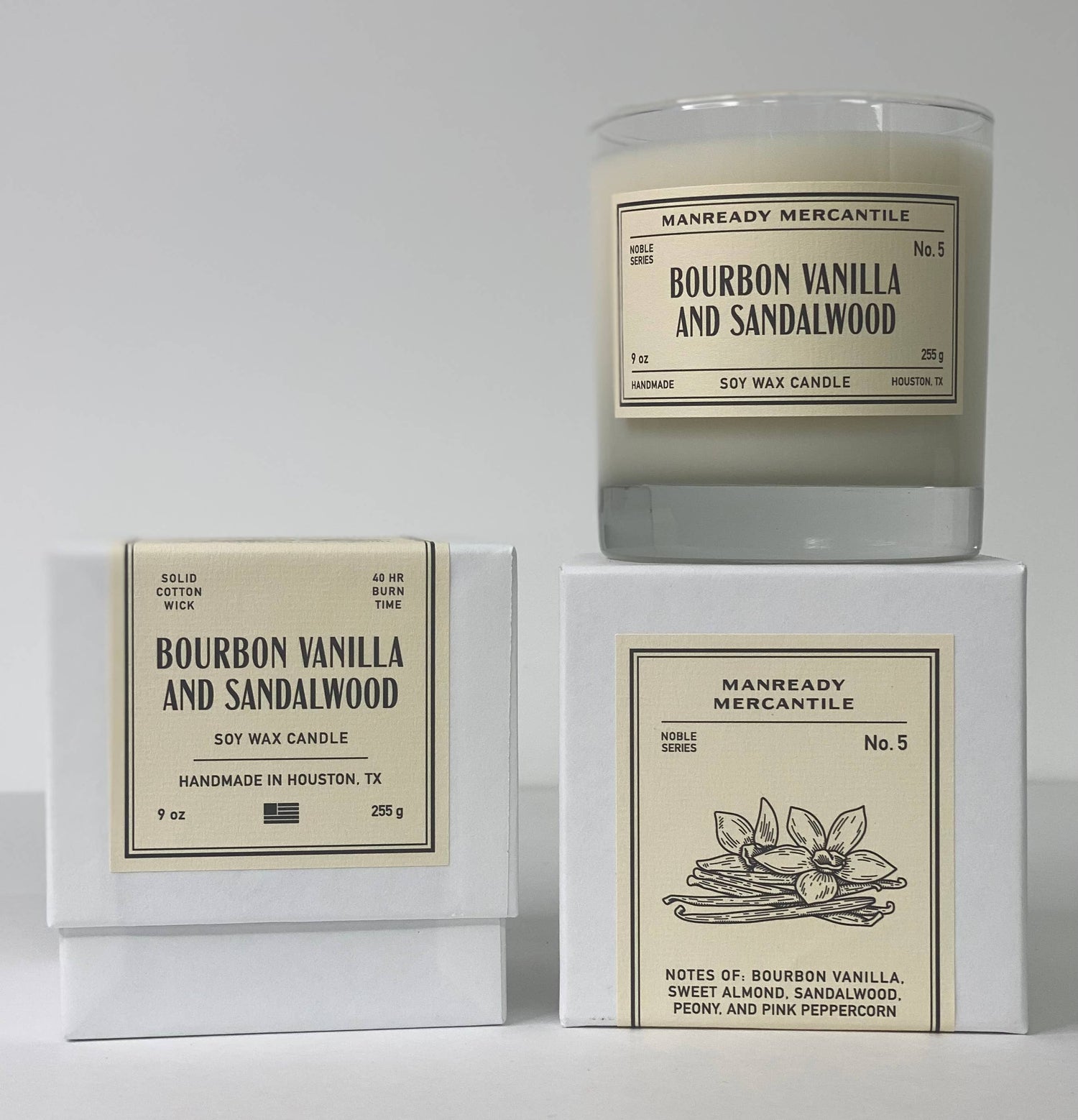 Candle with packaging labeled 'Bourbon Vanilla and Sandalwood' from Manready Mercantile on a white background.