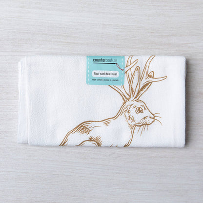 Flour-sack tea towel with hare design and 'counter couture' label on a light gray background