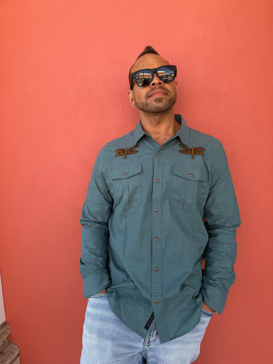 Man wearing a blue jacket against a red background