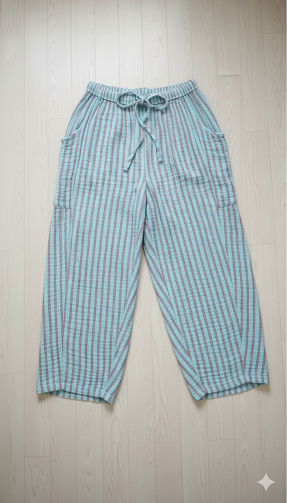 Plaid pants on a wooden floor