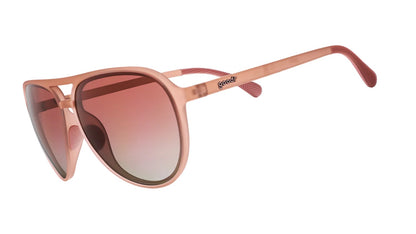 Rose gold sunglasses with gradient lenses on a white background