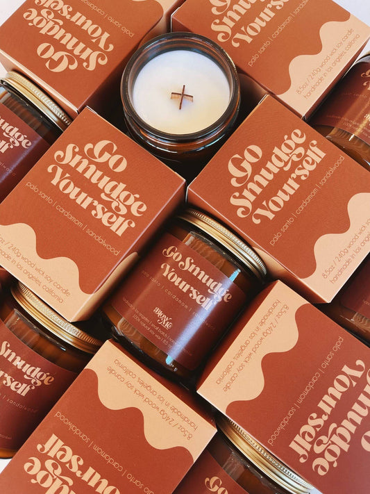 Go Smudge Yourself candles and packaging with a rustic design.
